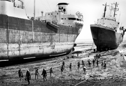 workers prepare to dismantle a ship 