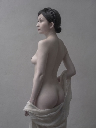 Nude showing back  
