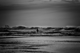 fisherman and rough waves 