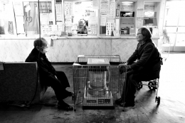 Two people in a waiting room 