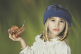 Little girl with snail 